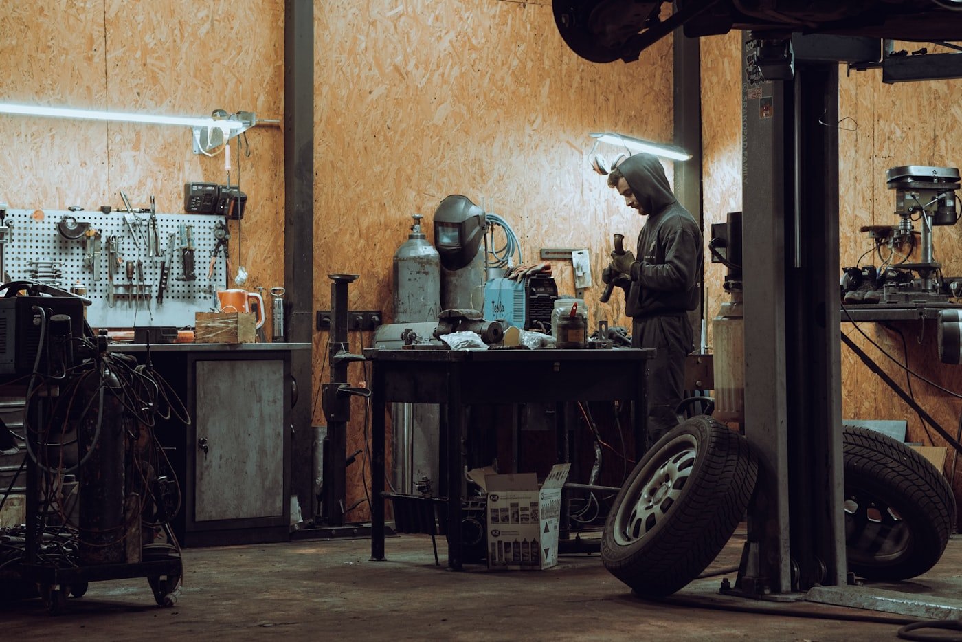 Skilled mechanic working on a vehicle in the workshop